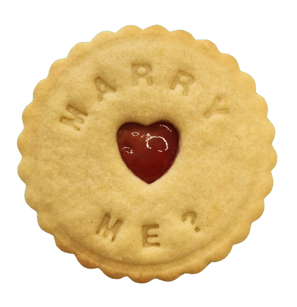 Handcrafted biscuit featuring the message 'Marry me,' created by The Biskery.