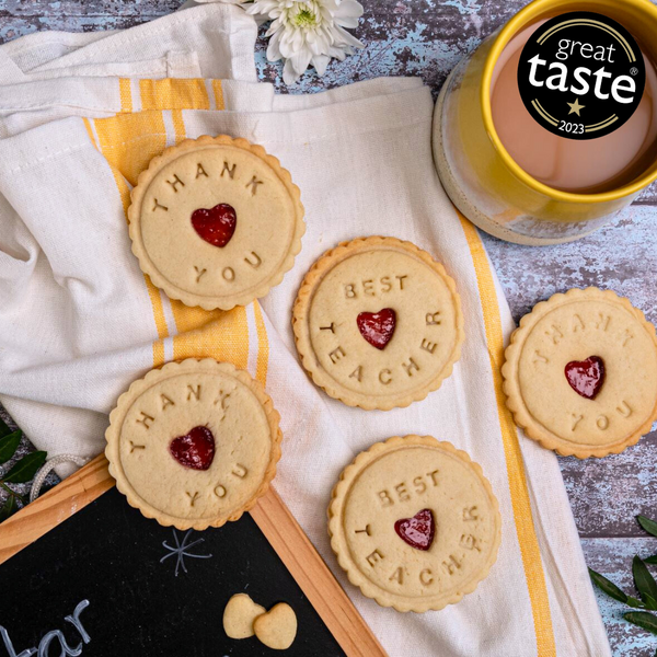 Delectable treats for amazing teachers! Box of "Best Teacher" biscuits with "Thank You" message.