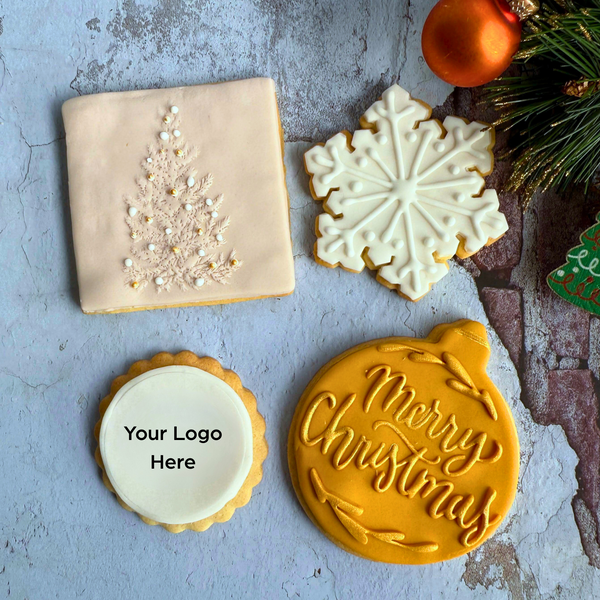 Decorative cookies with embossed designs on a textured surface, featuring 'The Biskery' branding.