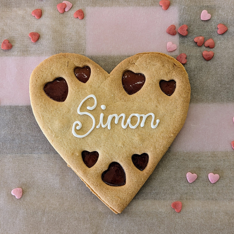 Giant Personalised Heart Cookie with the name Simon on it has.