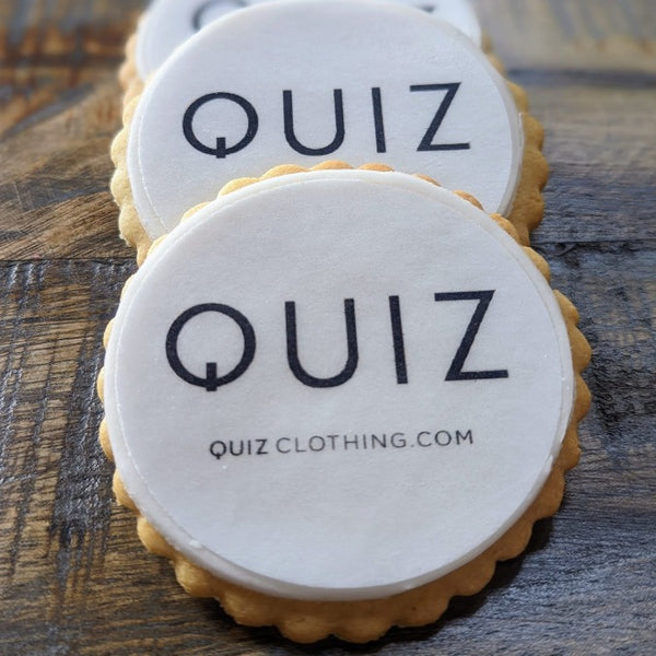 Quizz clothing branded Company logo biscuits made by The Biskery