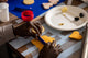 Variety of icing colors and toppings used in a Biscuit Decorating class