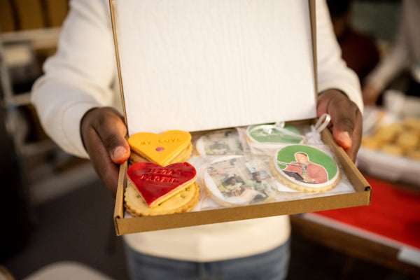 Variety of icing colors and toppings used in a Biscuit Decorating class