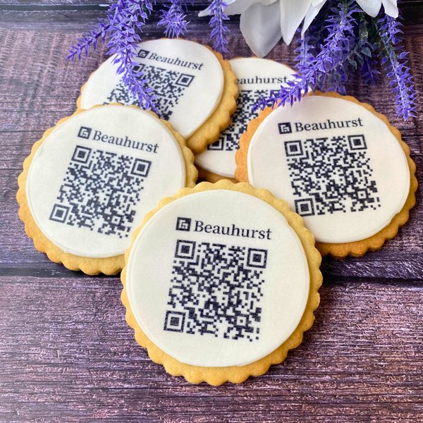 Biscuits with the QR code on them. placed on a table. handmade by The Biskery