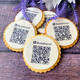 Biscuits with the QR code on them. placed on a table. handmade by The Biskery