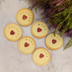 The biscuits, adorned with various patterns including the letters 'WELCOME BABY', are a delightful treat for new parents, guaranteed to bring a smile to their faces.