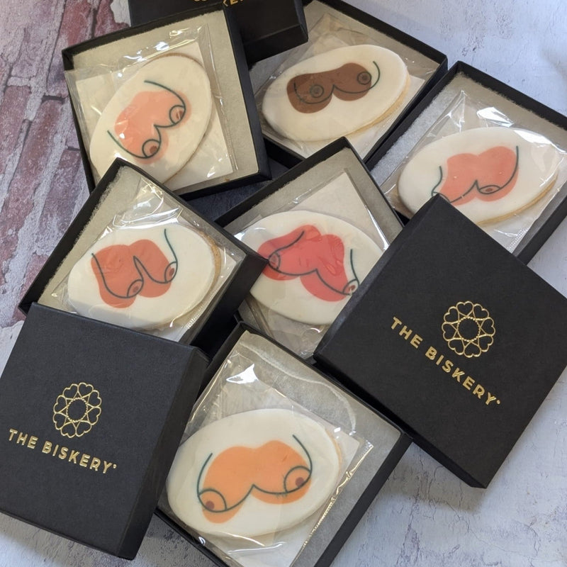 Biscuits with boobs/breasts printed on them in all shaped sizes and colours. Packed into small The Biskery branded boxes.