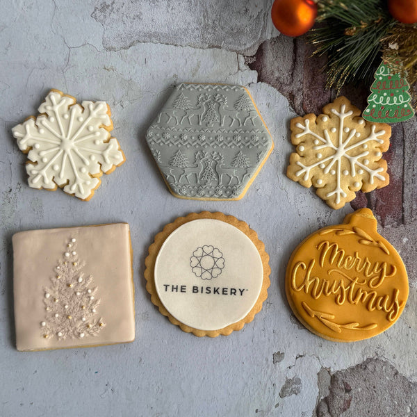 Decorative biscuits with branded details and textured surfaces with Christmas detailing.
