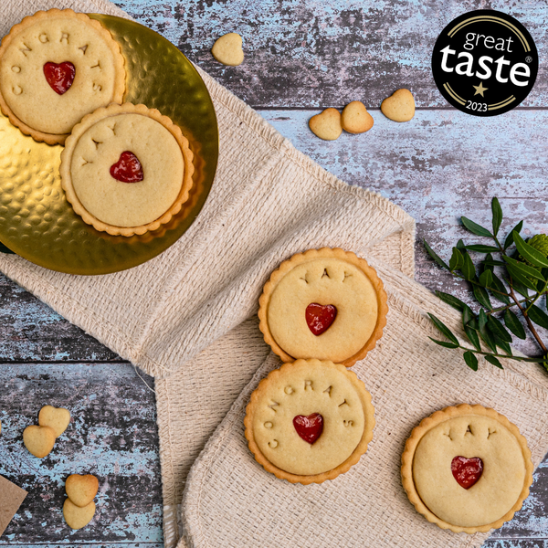 A plate of congratulations biscuits decorated with hearts and message, perfect for celebrating special occasions