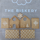 DIY Biscuit Decorating Kits featuring a small gingerbread house, perfect for creative and festive fun from The Biskery Company