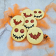 The batch of Halloween biscuits from The Biskery and a spider nearby. 