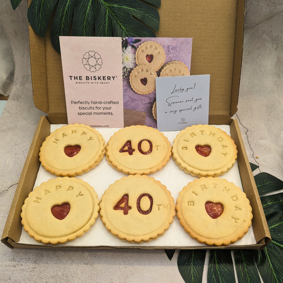 A close-up of a box of biscuits with a 40th birthday.