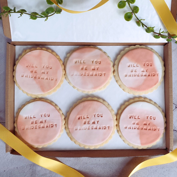  Box of cookies with "Will you be my bridesmaid?" sign. Thoughtful gift for a friend on their wedding day.