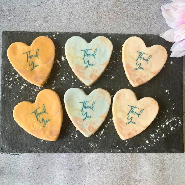 Box of six heart-shaped iced biscuits decorated with colourful "Thank You" messages