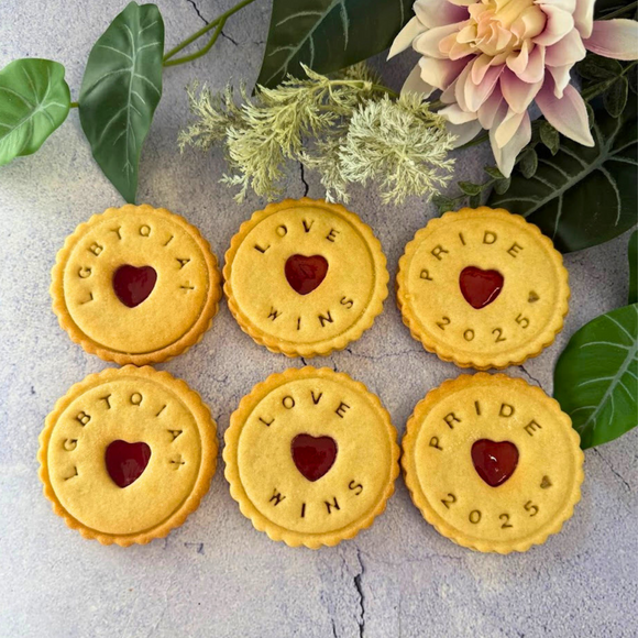  jam cookies with the words "LGBTQIA+", "LOVE WINS", and "PRIDE 2025" impressed on them