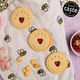 A close-up image of 'Welcome Baby' biscuits with a personalised name, a gift for a newborn from The Biskery