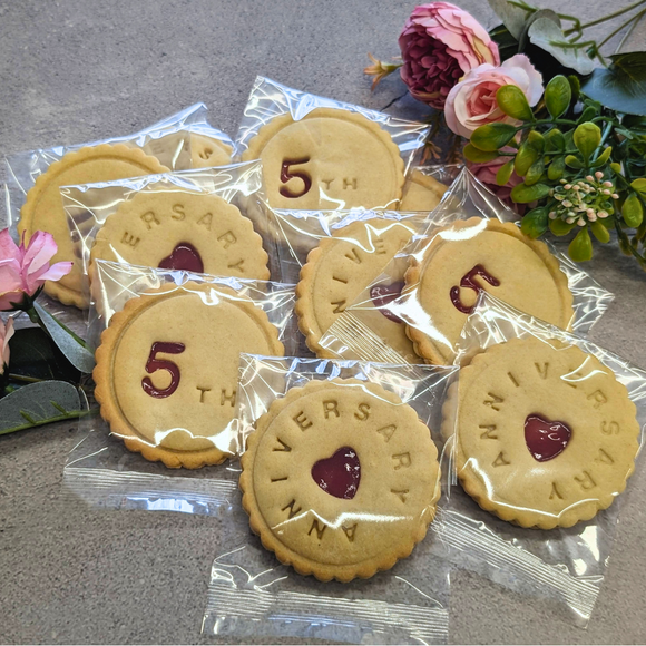 Individually wrapped anniversary biscuits with personalised designs