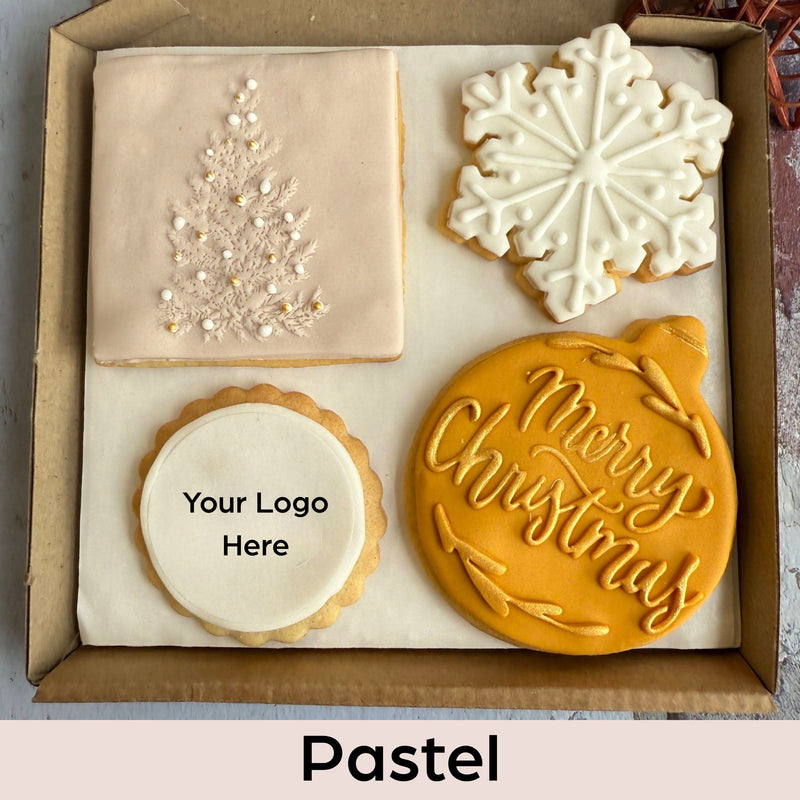 Decorative cookies with Christmas designs in a box labeled 'Pastel'.