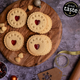 6 Personalised Christmas jam biscuits with the name impressed into the dough. sitting on a serving platter. made by The Biskery