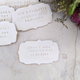 Personalised wedding biscuits with names and date, arranged on a table. Make your wedding even more memorable with The Biskery's biscuits.
