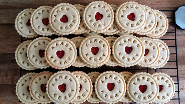 Personalised wedding biscuits impressed with name of bride and groom