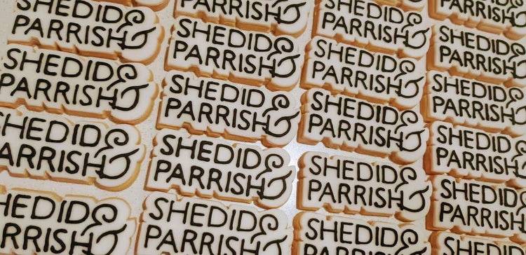 Bespoke shaped biscuits that follow the logo outline. Hand iced and placed on a grid of 20 biscuits. 