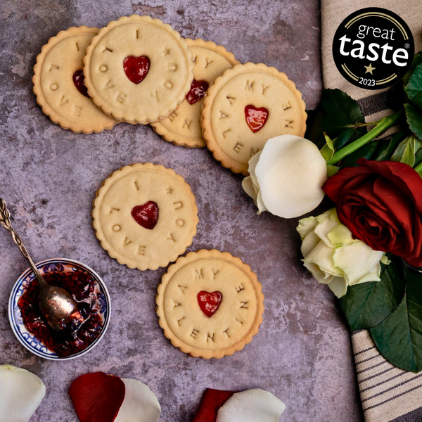 Valentine's Day Biscuits: a heart-shaped treat with jam and a festive message.