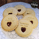 Cookies with 'Thinking of You' and 'With Sympathy' text on a decorative plate.