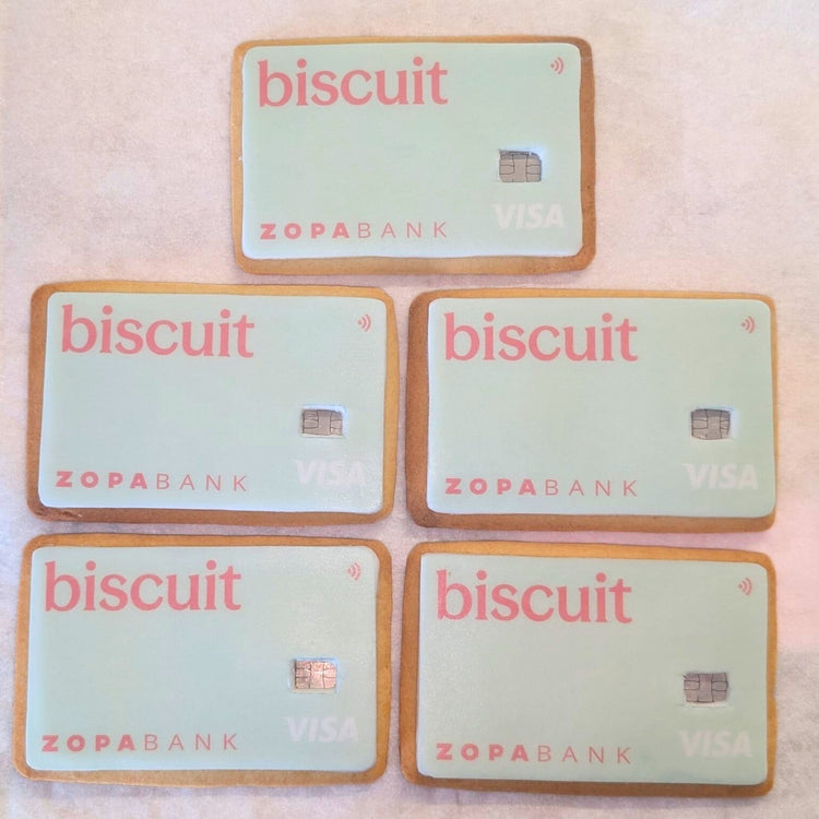 Five Zopabank Visa cards shaped like cookies on a light pink background. Made for PR media gifts