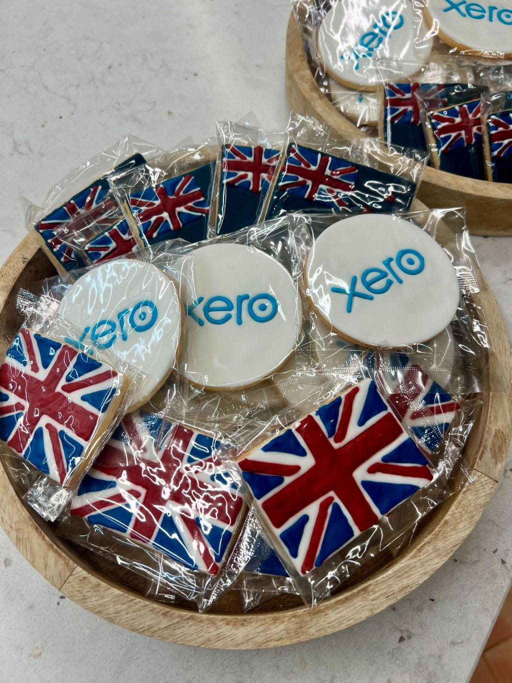 New Zealand flag, Union Jack and xero logo branded hand iced biscuits in a serving bowl