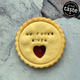 No fucks given message biscuit, handmade cookie with heart cut-out and glossy jam centre