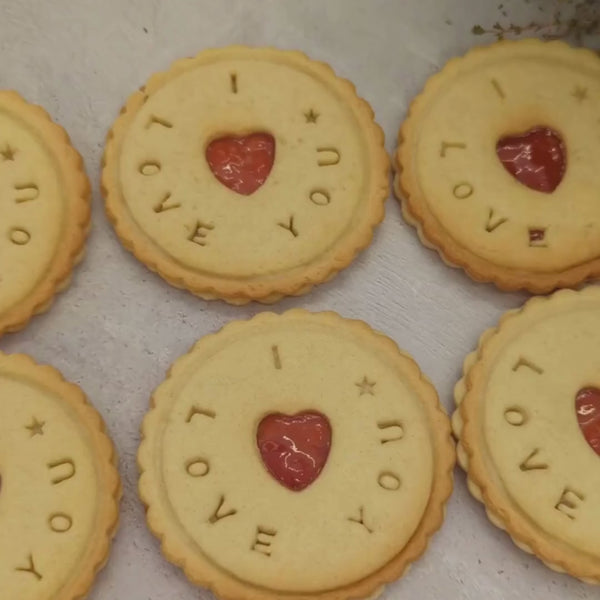 Close-up view of 'I love you' personalised branded jam biscuits from The Biskery company