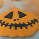The video with biscuits from The Biskery in the shape of pumpkins and bats, decorated with black and orange icing.