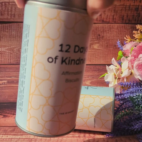 A person turns around a tin labelled '12 Days of Kindness'