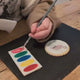 Video where the child is painting the biscuit from The Biskery. 