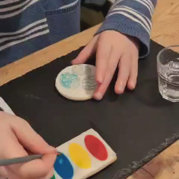 Child enjoys Easter Biscuits Decorating Kit, sparking creativity and joy in a fun-filled video