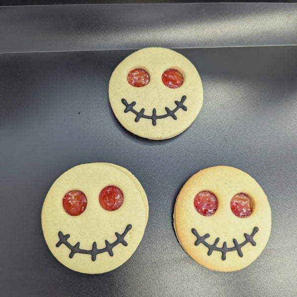 Video with Halloween biscuits Some of the Biscuits have large, round eyes, while others have sharp teeth.  