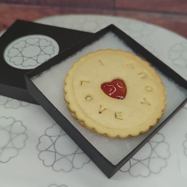 A box with 'I love you' biscuit