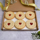 There are Assortment of delicious Valentine's Day biscuits decorated with hearts in the box