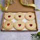 A box of six heart-shaped jam biscuits, adorned with the words 'WELCOME BABY' and a personalised name, with free shipping