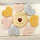 Affirmation heart biscuits in a box. An affirmation box filled with heart-shaped biscuits from The Biskery company, accompanied by free shipping