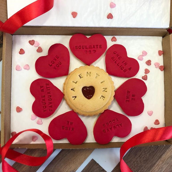A delightful box of heart-shaped Valentine's Day biscuits, decorated with colourful fondant, is presented in the charming letterbox gift.
