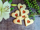 Sweet heart-shaped jam biscuits - a delicious treat for Valentine's Day or any other special occasion.